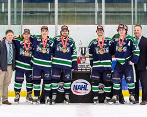 The North Iowa Bulls captains accept the Fraser Cup from NA3HL Commissioner Blake MacNicol (left) and NAHL Commissioner and President Mark Frankenfeld (right).